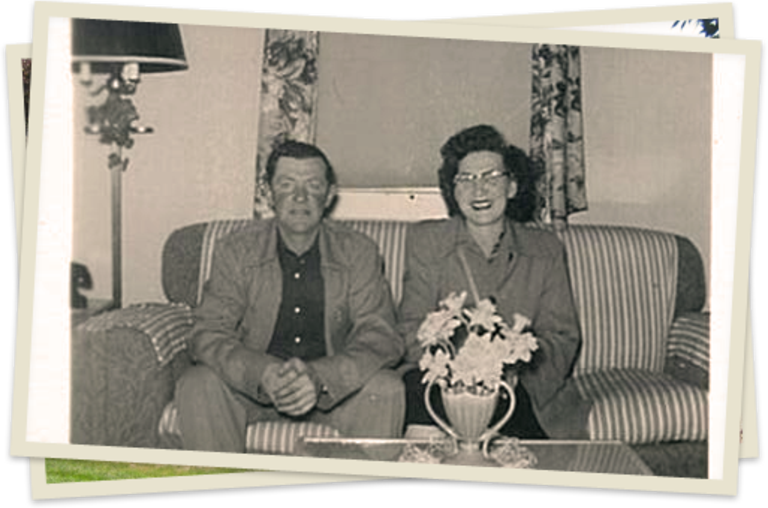 A man and woman sitting on the couch