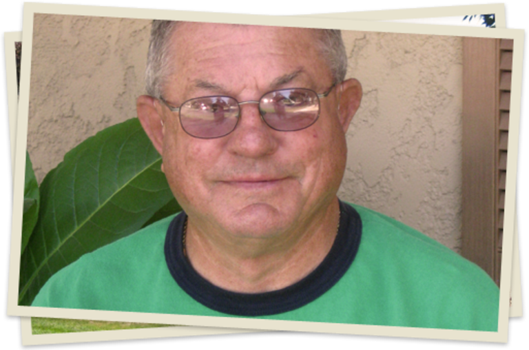 A man with glasses and a green shirt